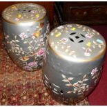 A pair of contemporary Chinese style silvered and floral painted barrel garden seats, each h.45cm