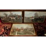 A set of three reproduction hunting prints, each 43 x 76cm, in oak frames