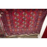 A Persian woollen red ground Bokhara rug having flatweave ends, 180 x 130cm