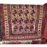 A Persian woollen cream ground Bokhara rug, with repeating central ground, 160 x 95cm