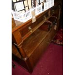 A late 19th century oak two-tier buffet whatnot, having twin frieze drawers, turned columns to