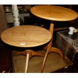 A light oak fixed top circular pedestal tripod occasional table, dia.40cm; together with a smaller