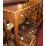 A contemporary mahogany five drawer spice table, raised on chamfered square supports, w.106.5cm