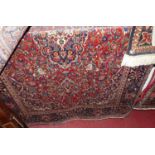 A Persian woollen red ground Tabriz rug, approx 200 x 135cmCondition report: Colour is good.One
