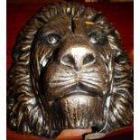 A contemporary gilt painted ceramic lions head, 42 x 43cm