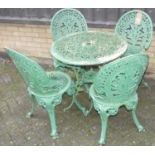 A Victorian style galvanised metal and later green painted floral pierced patio suite, comprising