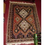 A small Persian woollen cream ground Tabriz rug, 145 x 108cm