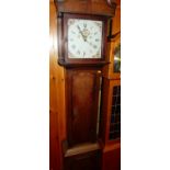 Circa 1900 provincial oak and mahogany cross banded long case clock, having a painted square dial,