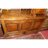 An 18th century and later adapted joined oak mule chest, having single upper cupboard central