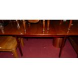 A probably White & Newton 1960s teak extending dining table, having pull-out action, single fold-out