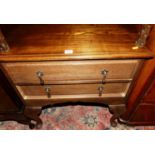 A contemporary oak low chest, of two long drawers, raised on cabriole supports, w.66cm