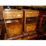 A pair of walnut crossbanded and floral relief carved bedside cupboards, each having upper