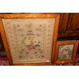 A Victorian woolwork depicting flowers and insects, 52x44cm in birds eye maple glazed frame,