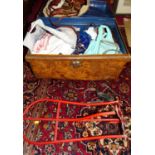 A metal trunk and contents of assorted saddlery tack, stirrups etc