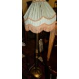 A giltwood turned and fluted standard lamp, with shade