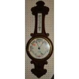 An early 20th century carved oak aneroid two-dial wheel barometer, the dial signed W.Jarrold,