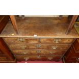 An 18th century provincial walnut, oak and featherbanded chest, of two short over three long