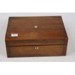 A Victorian rosewood and pewter strung work-box, of rectangular form, the hinged lid opening to