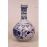 An 18th century Delft blue and white bottle vase, of typical shape, underglaze blue decorated with a