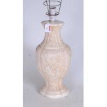 A 20th century Chinese style resin table lamp, of baluster form, carved with Cantonese style