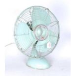 A 1950s KDK green painted electric table propeller fan, h.50cm