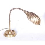 A 1930s brass adjustable desk lamp in the form of a clam shell, approx h.33cm