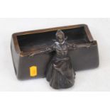 After Adolf Joseph Pohl, a bronze desk stand of rectangular form, surmounted by an Austrian girl,