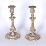 A pair of 19th century Mappin & Webb brass table candlesticks, having acanthus and C-scroll relief