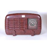 A 1940s Strad bakelite radio, with operating instructions, h.25cm