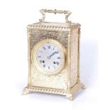 A 19th century brass cased mantel clock, the silvered dial showing Roman numerals, the eight day