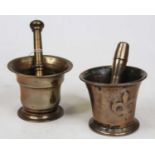 An early 20th century bronze pestle and mortar; together with one other (2)