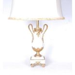 A 19th century style polished and brass mounted hardstone table lamp, the baluster form body flanked