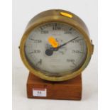 A mid-20th century brass cased pressure gauge, measuring pounds of pressure per square inch,