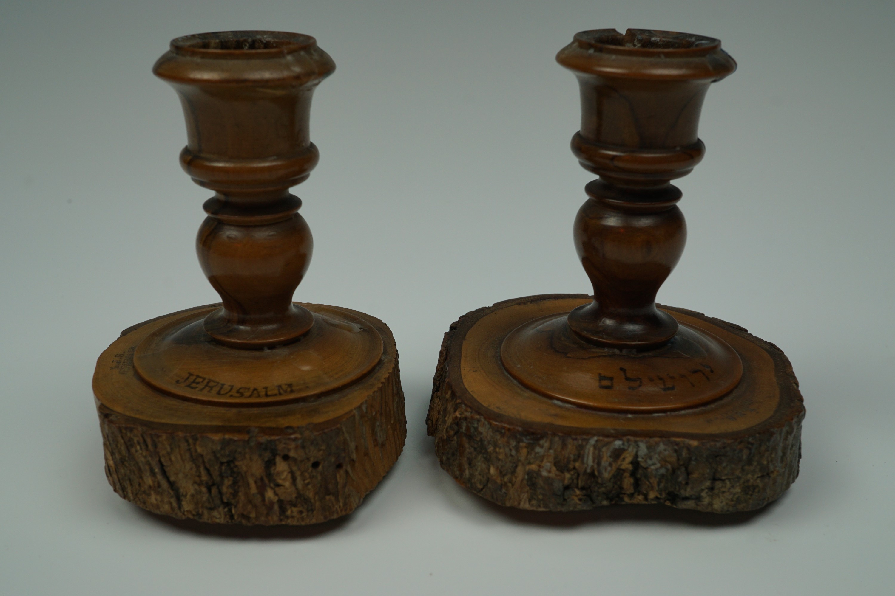 A pair of early 20th Century Jerusalem turned olive wood candlesticks, 7.5 cm
