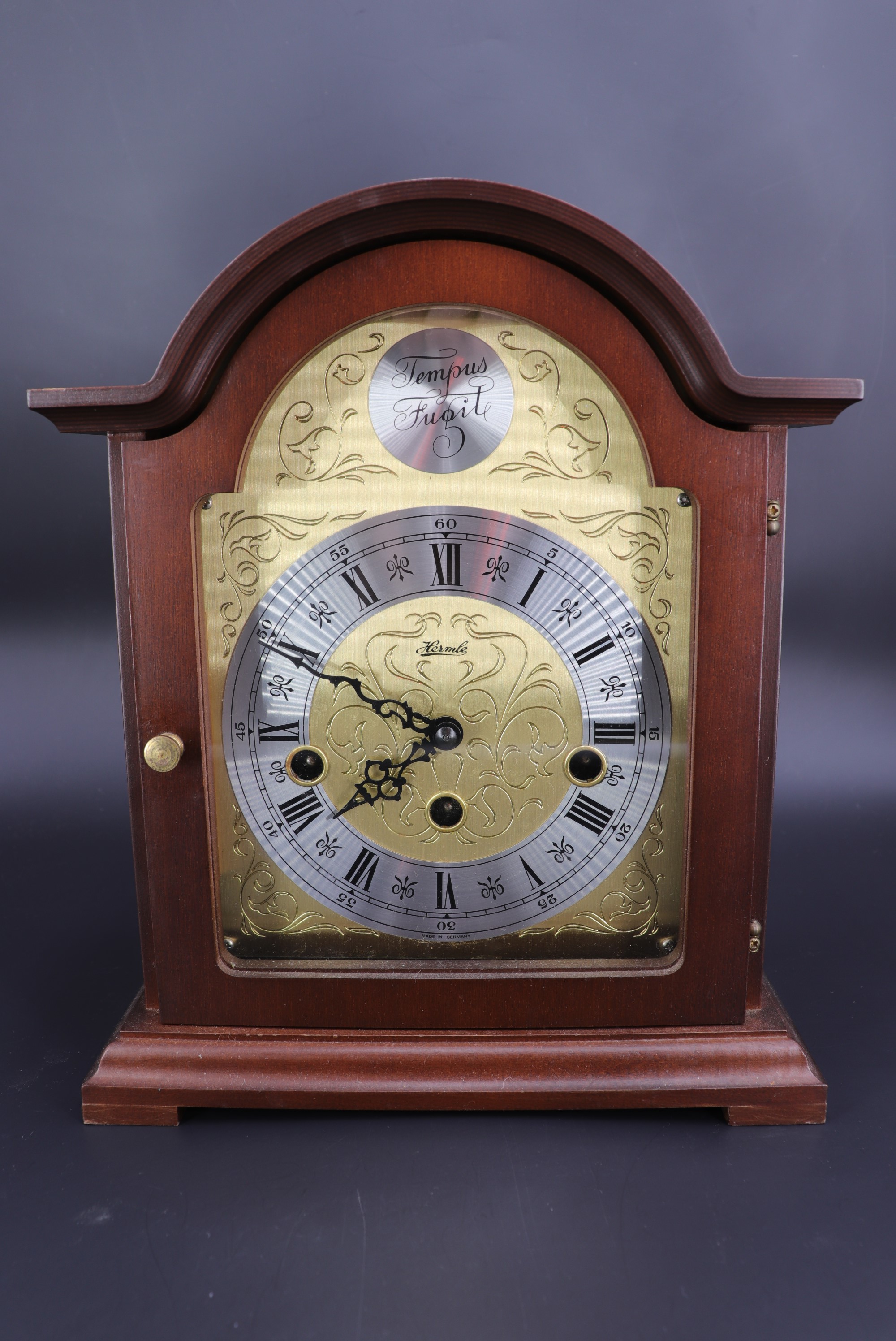 An Hermle mahogany cased mantle clock, having a three-train movement, 26 cm