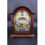 An Hermle mahogany cased mantle clock, having a three-train movement, 26 cm