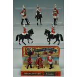 A 1970s new-old-stock hand-painted die cast Yeoman Warder, Guardsman and Household Cavalry trio