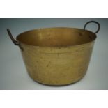 An antique heavy brass jam pan with a pair of wrought iron handles, 38 cm