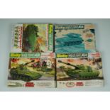 Four un-assembled Dinky Military Kits: 1034 155 mm Mobile Gun, 1035 Striker Anti-Tank Vehicle,