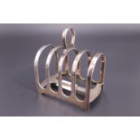 A 1930s silver four-slice toast rack with arched divisions, James Dixon & Sons, Sheffield, 1938,