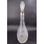 A QEII silver-collared cut glass wine decanter, of Indian club form, 38.5 mm