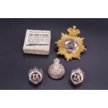 A Victorian British Legion badge, a King's Badge in issue carton, silver Royal Army Reserve and TA