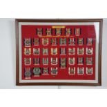 A pair of uniformly framed displays of British army cap badges, 53 cm x 68 cm