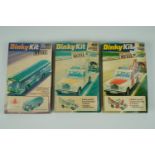 Three un-assembled Dinky Kit die-cast metal models: 1023 Single Decker Bus and 1030 Land Rover