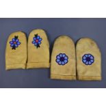 Two pairs of Inuit, native north American or First Peoples beadwork and leather mitten gloves