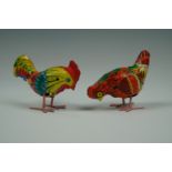 Two clockwork tinplate chickens