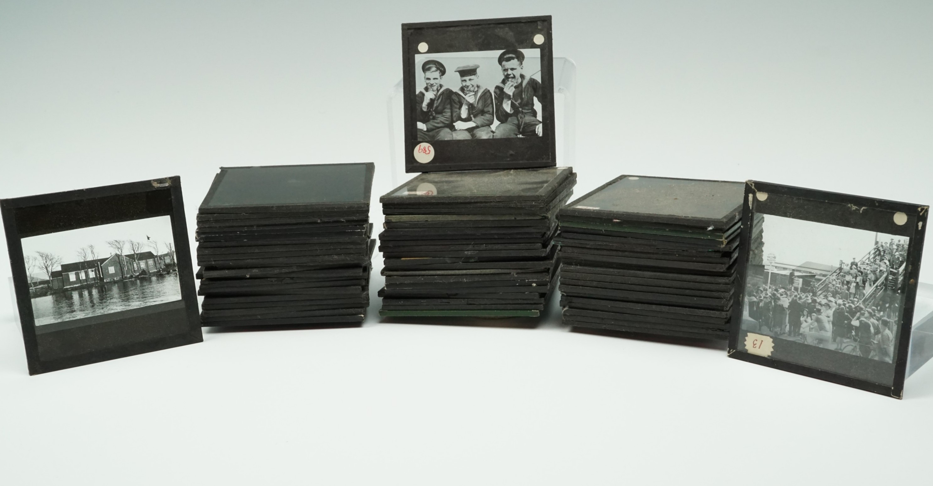 A quantity of early 20th Century monochrome photographic magic lantern slides largely depicting