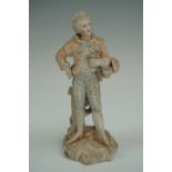 A late 19th / early 20th Century German semi-bisque porcelain figurine of a romanticized 18th