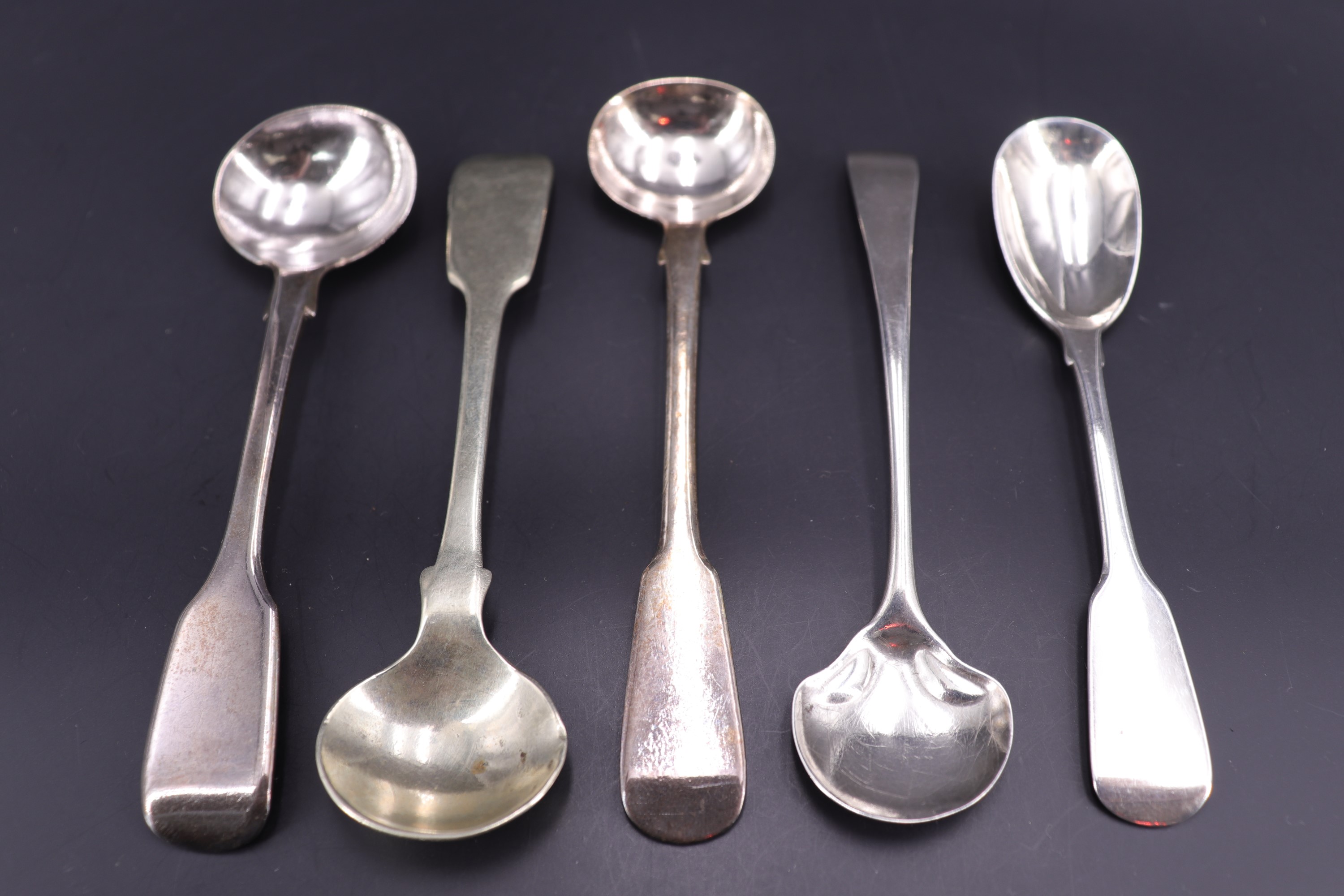 Four Georgian / Victorian silver salt and mustard spoons together with an electroplate salt spoon