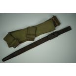 A British army 1908 Pattern webbing belt, Pattern 1907 bayonet scabbard and frog